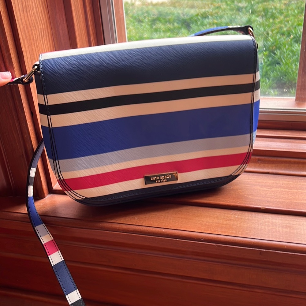 Kate Spade small crossbody bag. Blue, red, white, black striped. Never been used